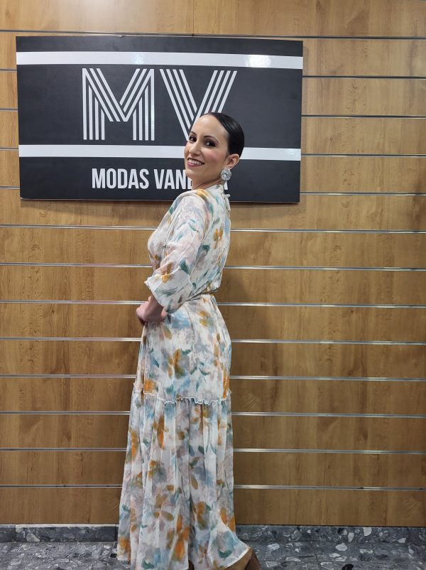 Vestido Gasa con estampado floral naranja y turquesa con cintura elástica.